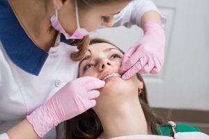woman asking Can Your Oral Health Be Improved By Cleaning Your Braces