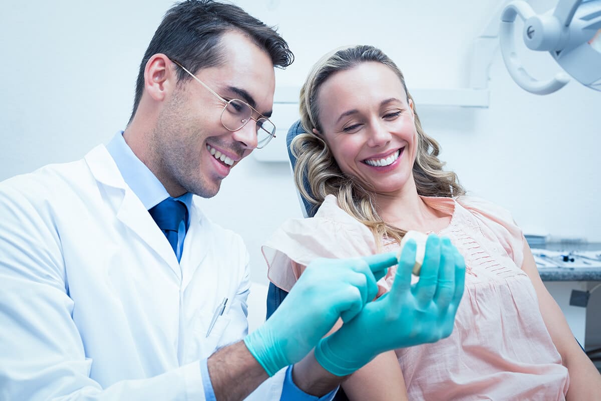 Doctor explains to patient how to treat gingivitis