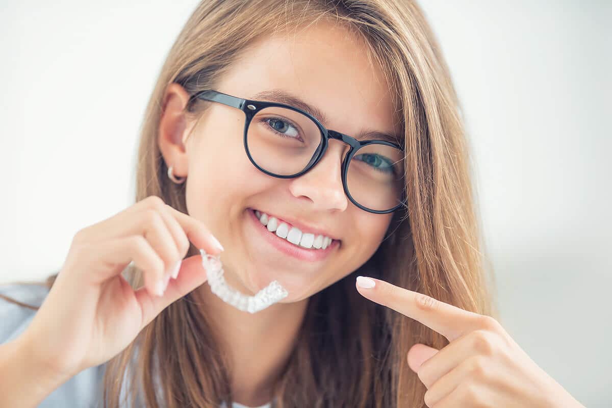 a young woman learning about invisalign results